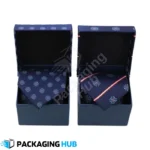 Custom tie box with luxurious interior, showcasing a necktie. Ideal for gifting on special occasions.