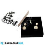 Custom earring box with multiple compartments for organizing earrings, rings, and other small jewelry items.