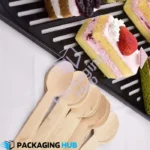Disposable wooden spoon designed for serving ice cream, providing a comfortable grip.